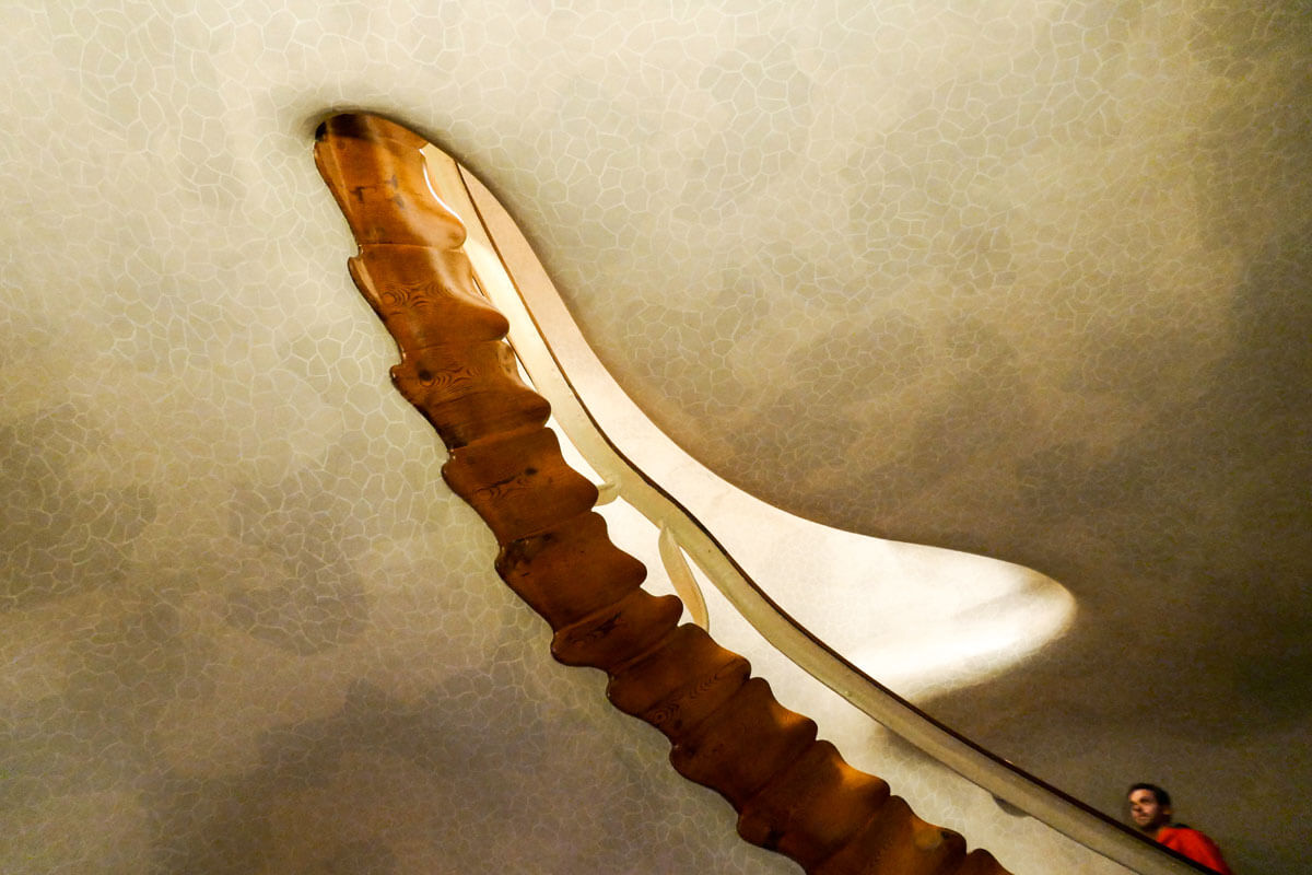 Wooden spiral staircase at Barcelona's Casa Batlló, featured on architecture tour Inside Gaudí