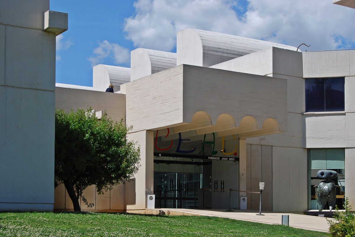 Entrance with cantilevered roof to Barcelona's Joan Miró art museum, a sculptural white concrete building