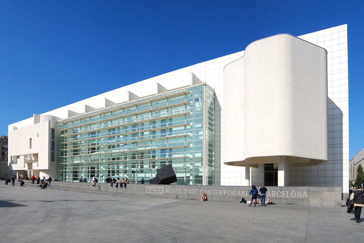 Barcelona's white MACBA building gleaming against the blue Mediterranean sky, featured on architecture tour Sant Antoni-Raval