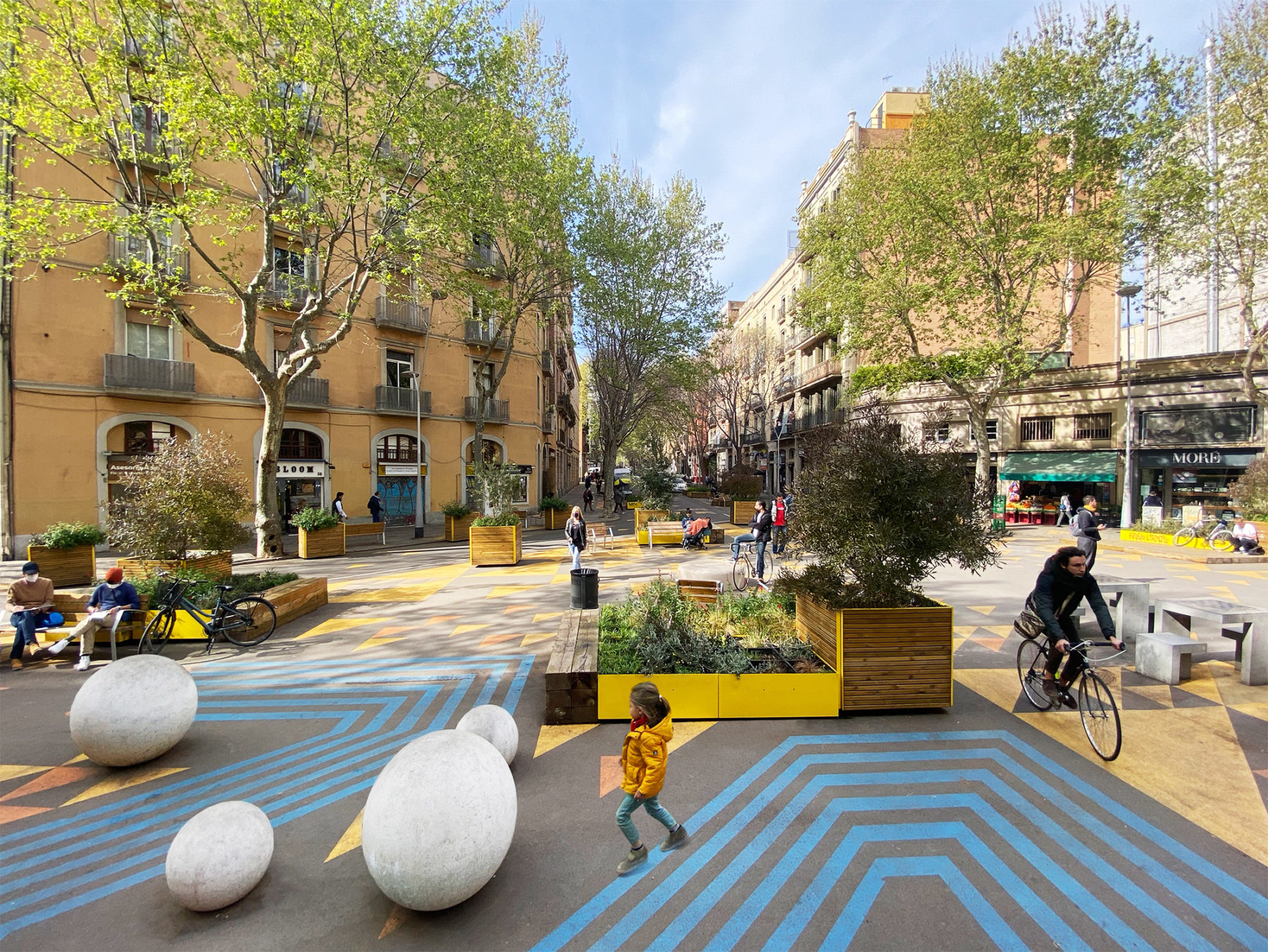 Eixample road junction turned green space with yellow street paint and temporary urban furniture, Leku Studio